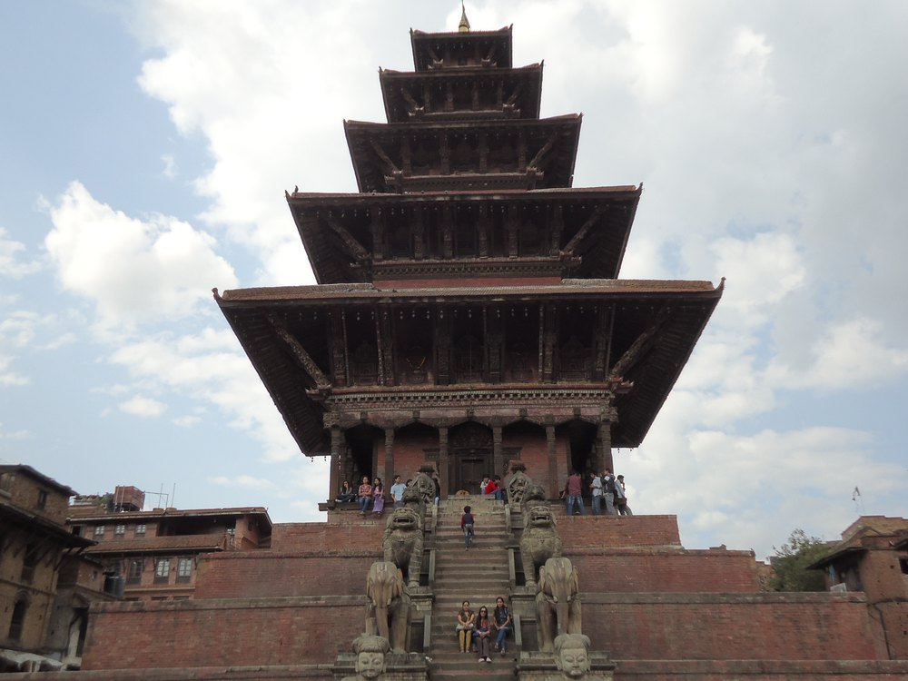 Traditional Nepali pagoda temple with Himalayan peaks