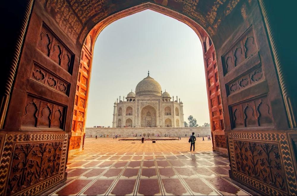 The Taj Mahal seen through a carved archway